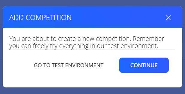 Aviso al crear una competición con los botones Go to test environment y Continue